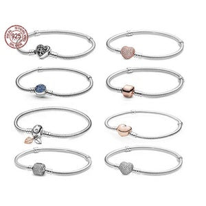 Silver-tone heart clasp snake chain bracelet with assorted heart charm colors