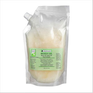 Monoi oil carrier oil pouch with white label and small spout cap