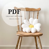 a crochet pattern for a large daisy pillow fits the boho bedroom of a room not only for a child, the amigurumi method spring flower motif