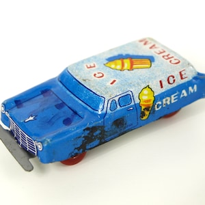 Vintage tin ice cream delivery car, blue with printed ice cream graphic, Nakamura