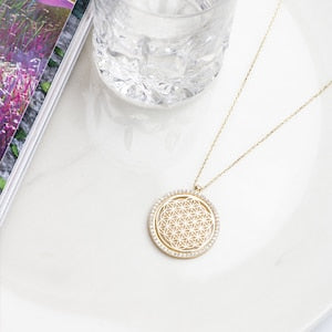 14K gold flower of life pendant necklace with round filigree pattern on chain