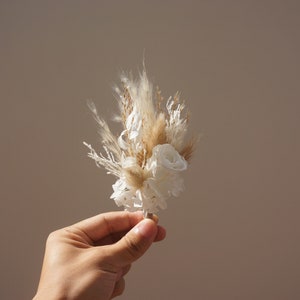 Dried rose boutonniere with beige pampas grass and white accents