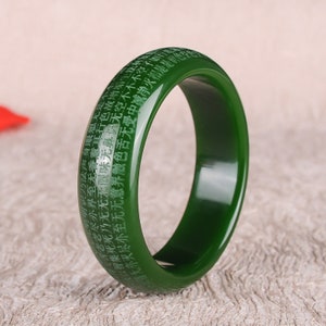 Dark green jade bangle bracelet with engraved characters