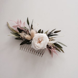 Floral hair comb with white rose, black leaves, and pink accents