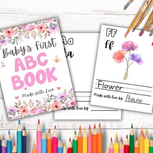 Customizable baby’s first ABC book with floral cover, butterflies, and colorful crayons