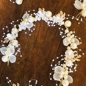 Boho floral tiara headband with white flowers, pearl beads, and dangling bead strands