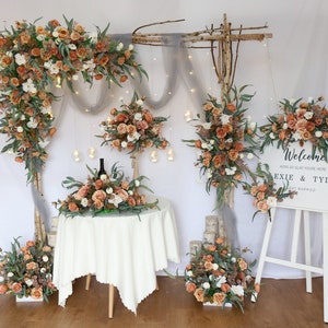 Autumn fall flower garland with terracotta and white blooms and green foliage