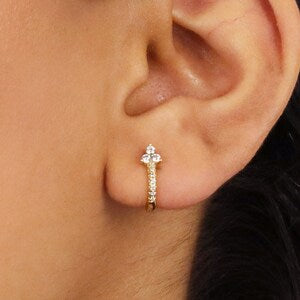 Silver flower charm huggie hoop earrings with small hoop and dangling floral detail