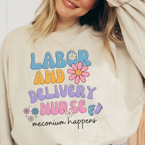 Beige nurse sweatshirt with Labor and Delivery graphic, 'meconium happens'