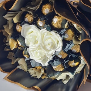 Chocolate bouquet with white rose decorations and wrapped chocolates