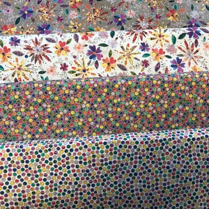 100% cotton quilting fabric with prismatic ditsy floral and rainbow dot leaf prints