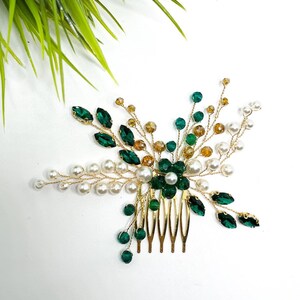 Bridal hair comb with emerald green crystals, ivory pearls, and gold-tone prongs