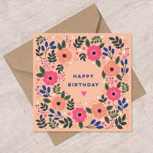 Floral birthday card with pastel flower wreath and Happy Birthday text