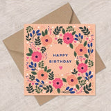 Floral birthday card with pastel flower wreath and Happy Birthday text