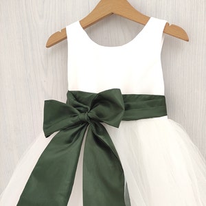 Toddler flower girl dress with white bodice, olive waist sash and oversized bow