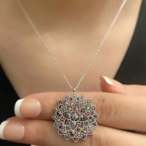 Sterling silver Flower of Life pendant necklace with circular engraved medallion