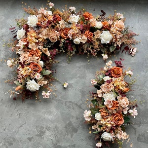 Faux fall floral wreath garland with rust, beige, and cream flowers for wedding decor
