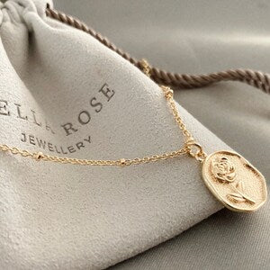18K gold flower pendant on satellite chain, oval locket pendant