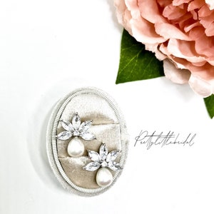 Silver oval crystal and pearl flower drop earrings with dangling studs