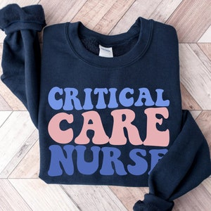 Navy sweatshirt with 'CRITICAL CARE NURSE' front print, long sleeves
