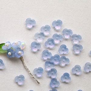 Light blue 3-petal glass flower beads, 12mm, translucent flower shapes with thread