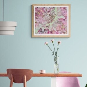Framed abstract fluid art canvas with pink and purple floral swirls