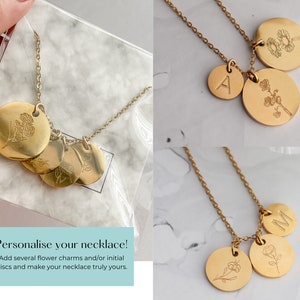 Gold-tone birth flower necklace with round engraved pendants on chain