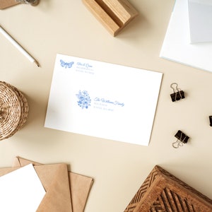 Envelope address label sheet with blue flower and dragonfly designs