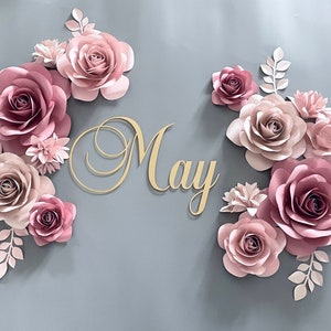 Blush paper flower wall decor set with gold cursive 'May' and pastel pink blooms