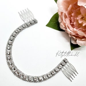Silver rhinestone hair vine comb with two prong combs, curved floral shimmer.