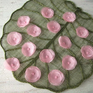 Handmade pink organza sew-on flower appliques with petal centers on sheer backing