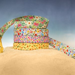 Floral dog leash with multicolor flower pattern on fabric strap
