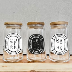 Glass iced coffee cup with wooden lid and circular coffee label