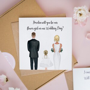 Personalized flower girl proposal card with two illustrated dresses and wedding-day text