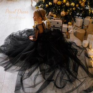 Black tulle flower girl dress with layered skirt and bow at back