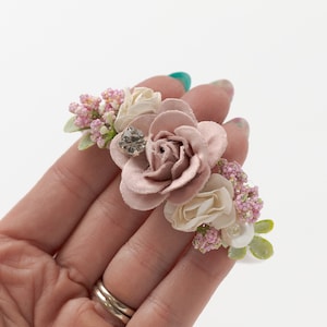 Newborn flower headband with blush pink and cream fabric roses and small green buds