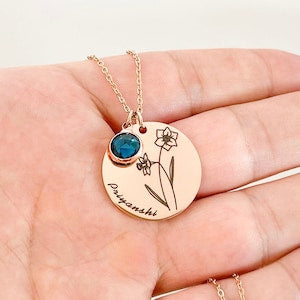 Rose gold birth flower pendant necklace with round engraved charm and blue birthstone