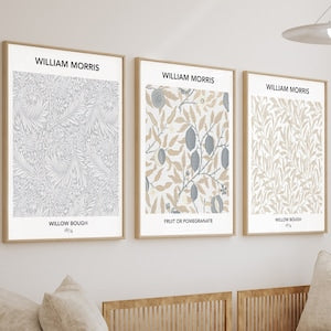 Set of three framed botanical print posters, leaf and wildflower patterns in light neutrals