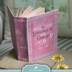 Pocket-sized Language of Flowers book with purple hardcover and embossed title lettering