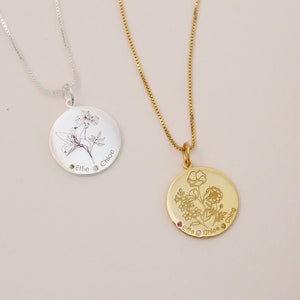 Two round birth flower family pendant necklaces with engraved tree and floral designs