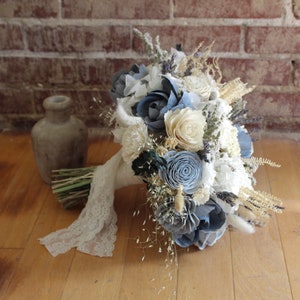 Dusty blue and ivory wood flower wedding bouquet with lace ribbon accents