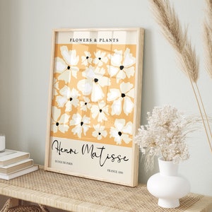 Framed flower market art print with white and beige blossoms and cursive signature