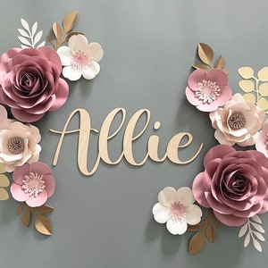 Mauve pink paper flower wall decor set with cream and blush blooms, plus “Allie” sign