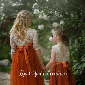 Burnt orange tulle flower girl dress with white lace long sleeves, bow accents