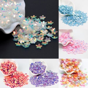Loose flower-shaped cup sequins in pastel blue, pink, purple, and multicolor mix