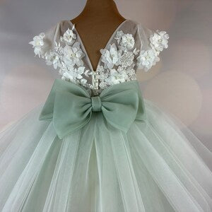 Sage green tulle flower girl dress with 3D floral appliques and bow at waist