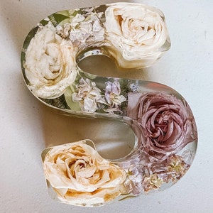 Resin floral letter decor with cream and mauve preserved flowers in clear resin