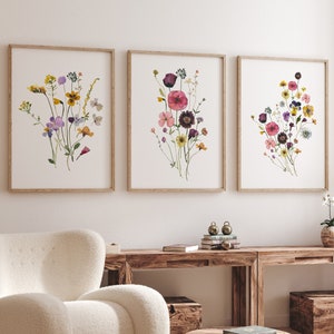 Set of three framed watercolor wildflower botanical prints with mixed blossoms