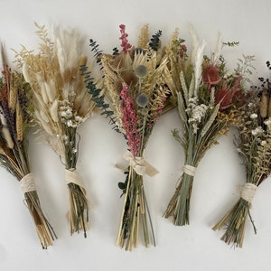 Set of boho dried flower bouquets, bundled with twine, in beige and pink tones