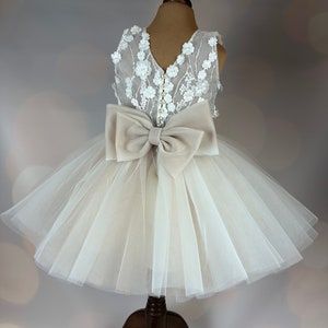 Champagne lace bodice tulle flower girl dress with 3D floral detail and large bow